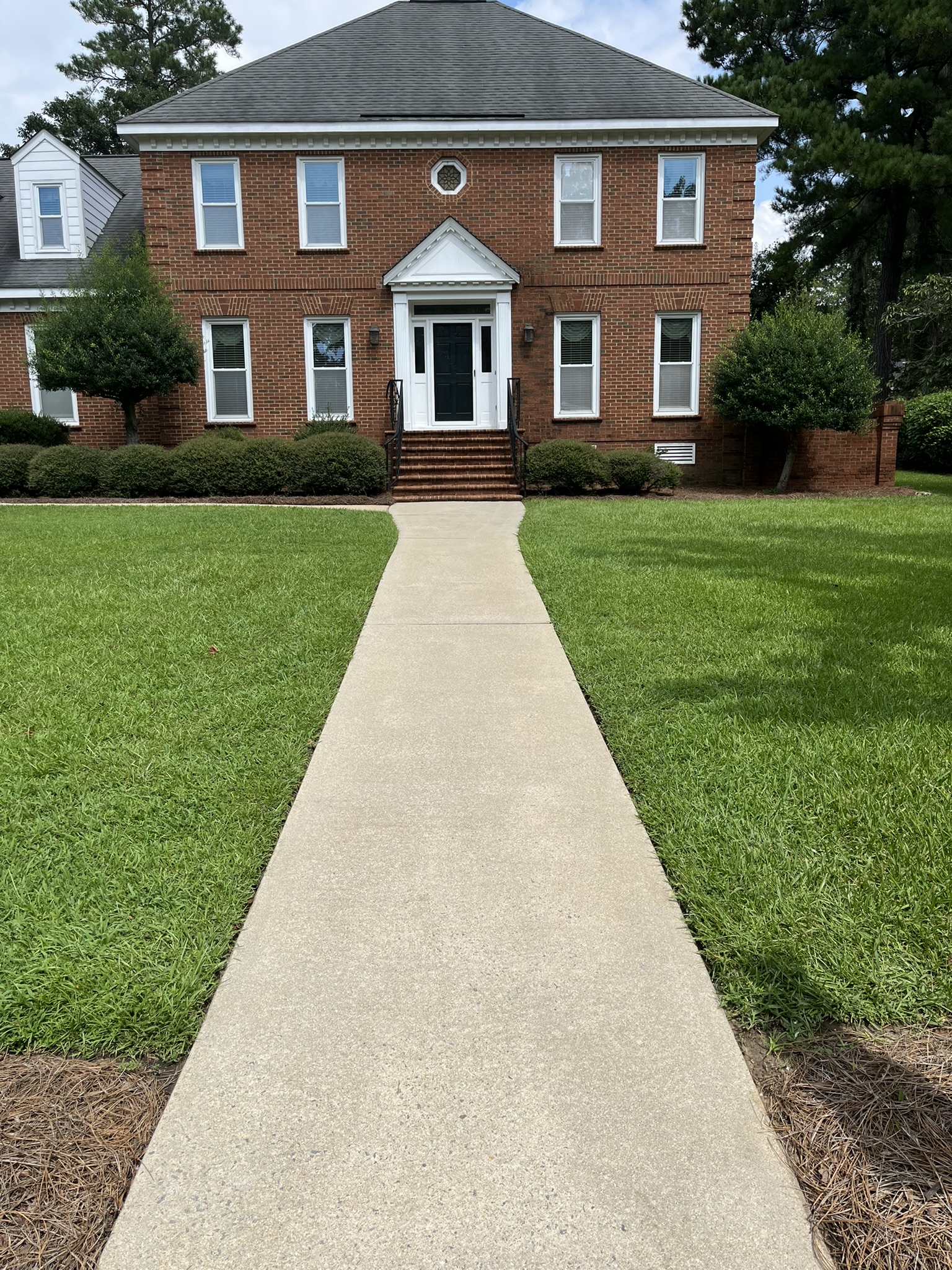 Clean sidewalk after pressure washing